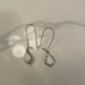 White and silver earrings